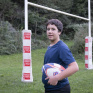  IES Saint-Paul - Jordan (3ème) pose avec un ballon de rugby